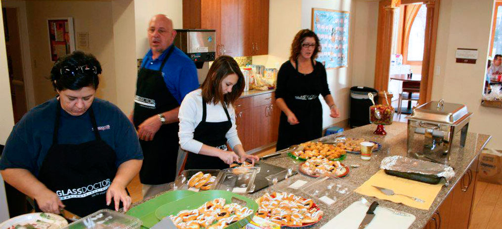 Glass Doctor volunteers serving food at a local Ronald McDonald House